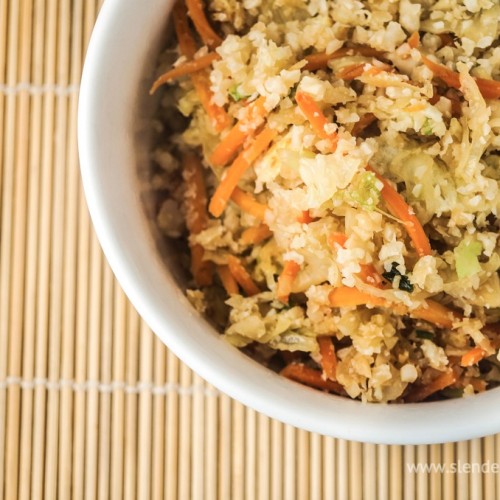 a white bowl with vegetable fried rice made with cauliflower