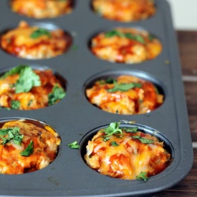 Cheesy Chicken Quinoa Enchilada Meatloaf Muffins in a gray miffin pan