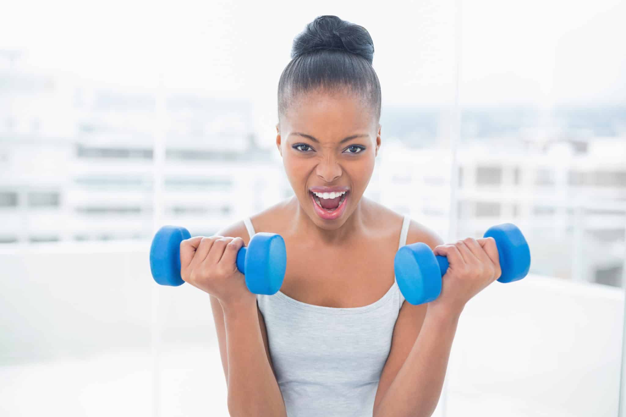 Woman with dumbbells.