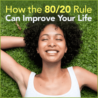 A smilling lady laying in grass with the words "How the 80/20 Rule Can Improve Your Life"