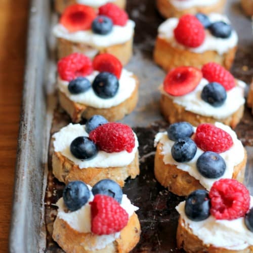 Summer Berry Crostinis on a baking sheet.