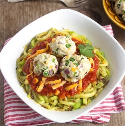 Make this healthy bowl of zucchini noodles topped with tomato sauce and cheesy turkey meatballs.