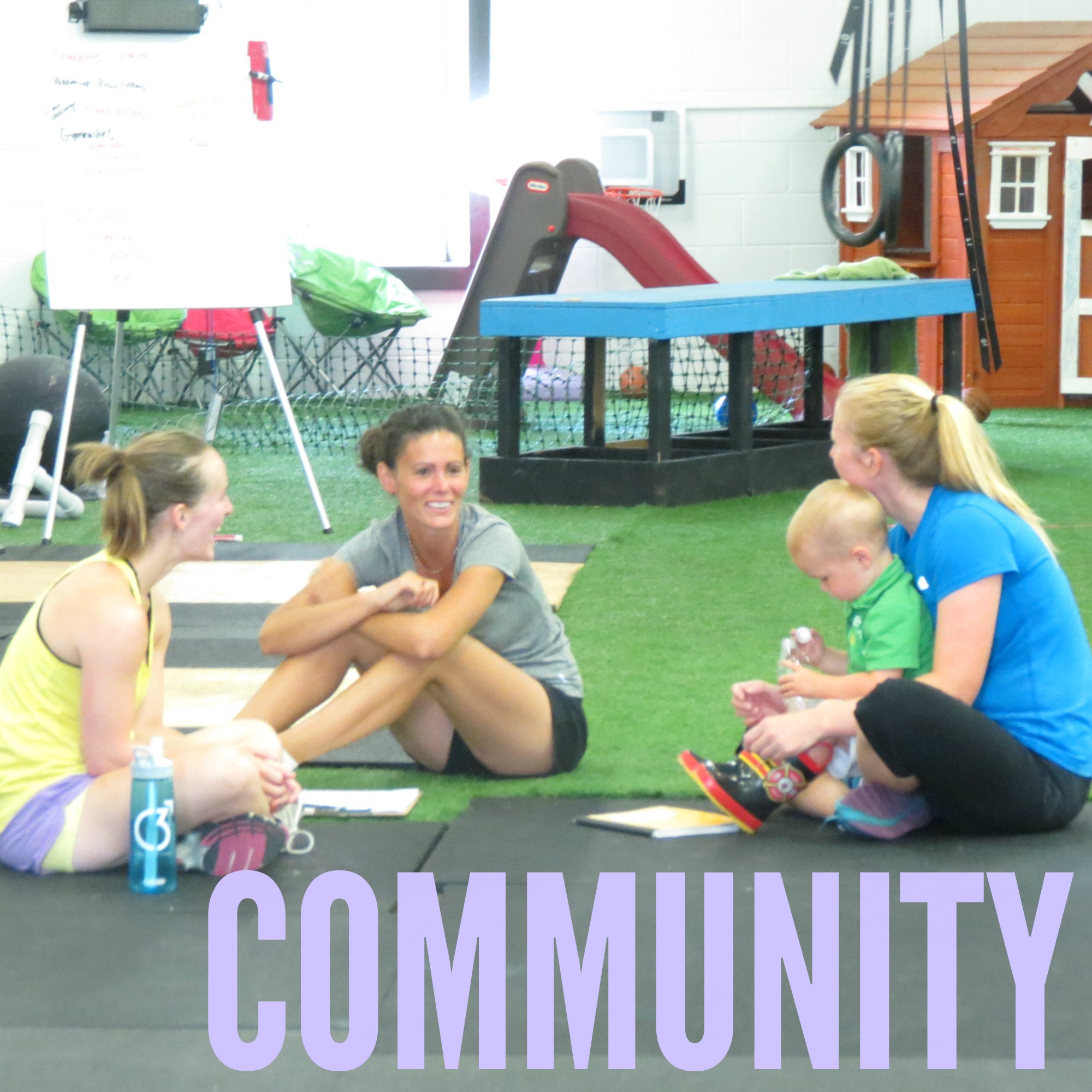 The community at CrossFit Box. Three moms sitting with their kids aftet a workout.