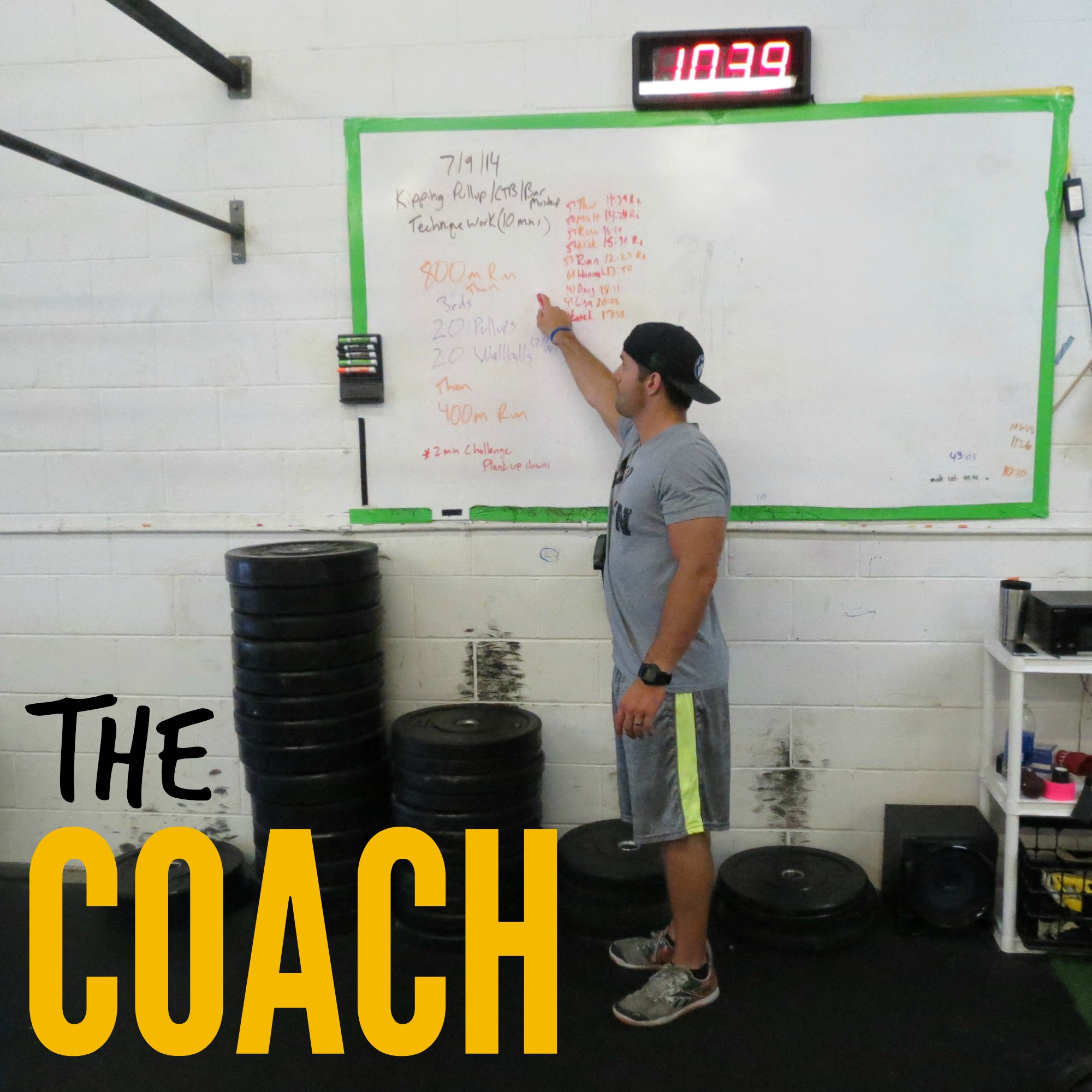A CrossFit coach describing the WOD for the day at the box.