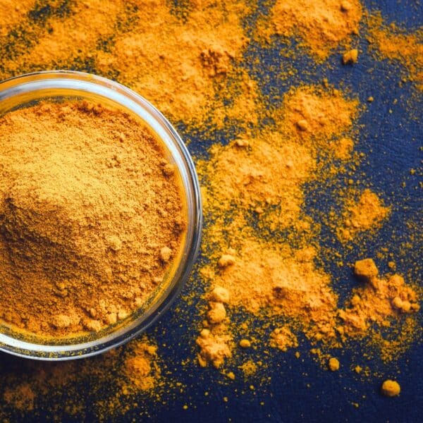 health benefits of turmeric with ground spice in bowl