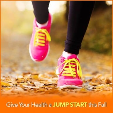 Pink tennis shoes running in leaves with the words "Give Your Health A Jump Start This Fall"