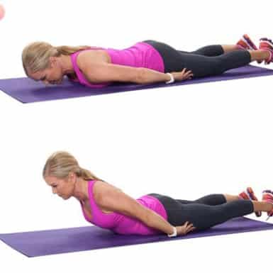 Chris Freytag demonstrating Mid-Back Extensions on a purple yoga mat.