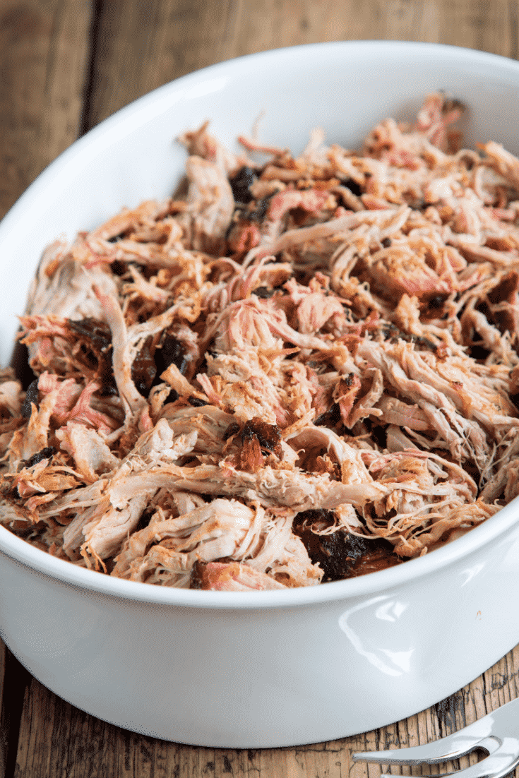 Shredded pulled pork in a white dish