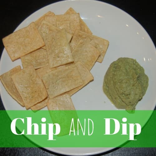 a picture of chips with a side of guacamole