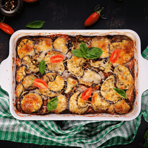 Casserole pan of eggplant lasagna with cheese and veggies