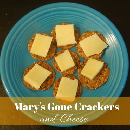 A plate with 7 crackers topped with Farmers cheese