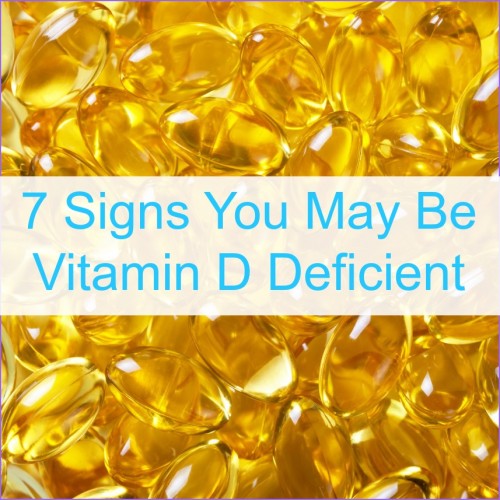 A background of Vitamin D pills with the words "7 Signs You May Be Vitamin D Deficient"