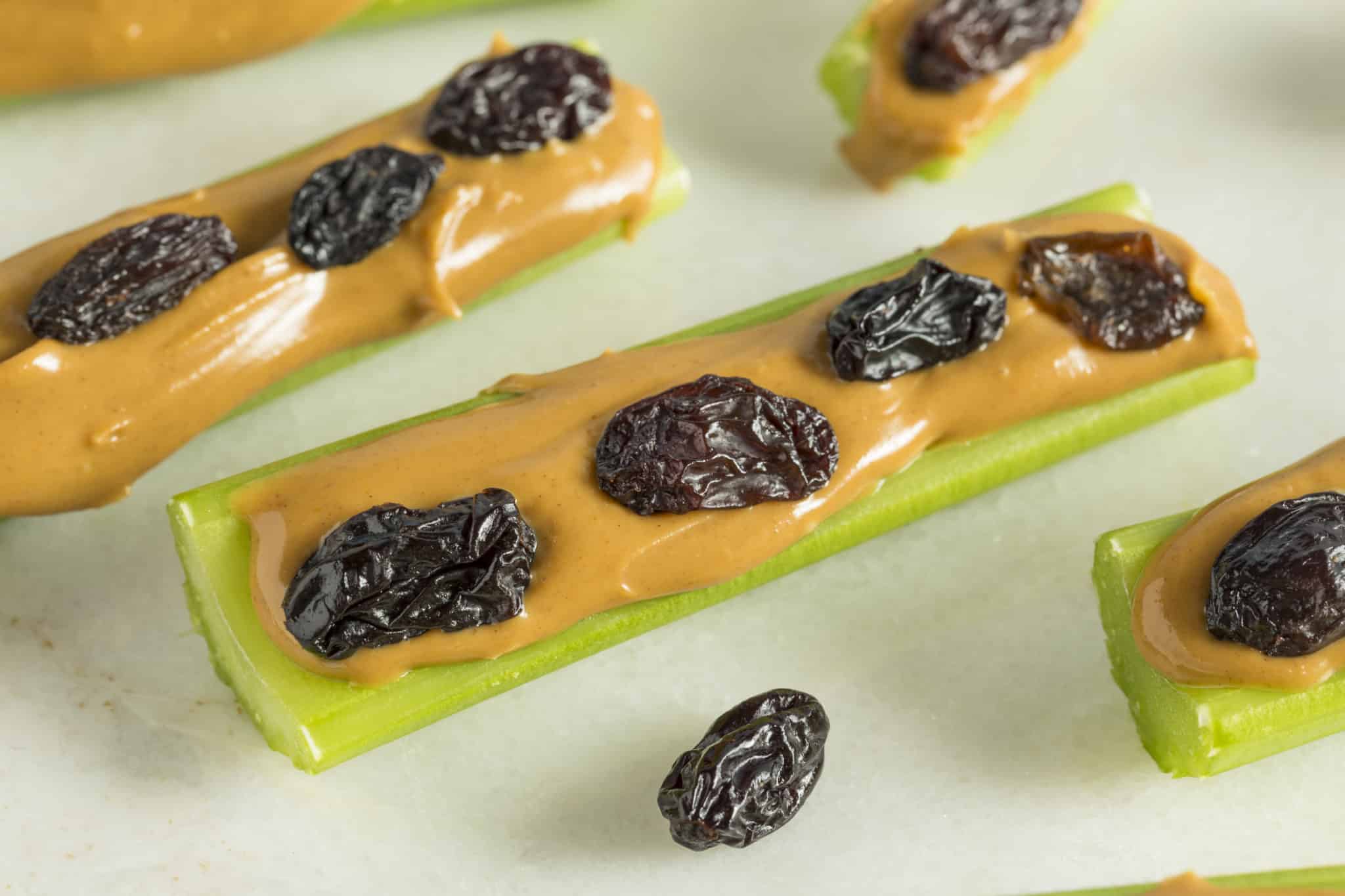 Celery sticks with peanut butter and raisins