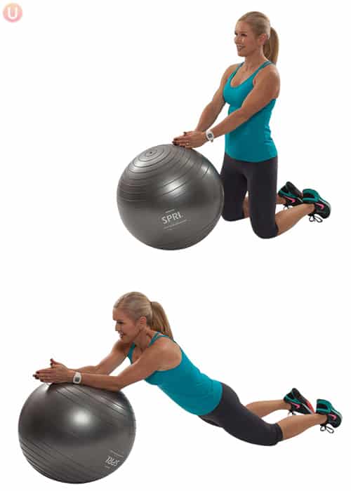Chris freytag demonstrating an ab roll out on a stability ball wearing black yoga pants and a blue top