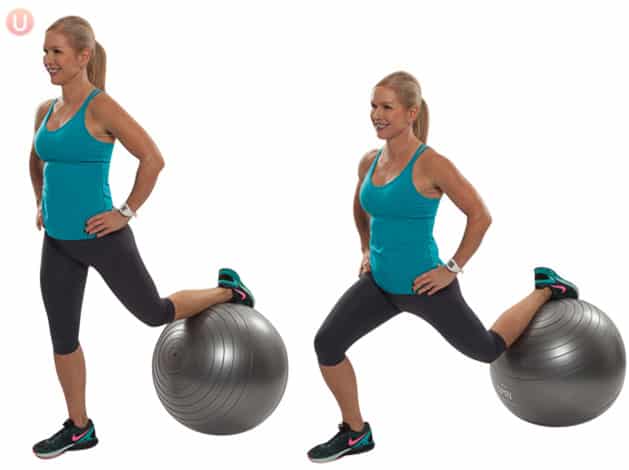 Chris Freytag performing a lunge on a stability ball wearing black yoga pants and a blue top