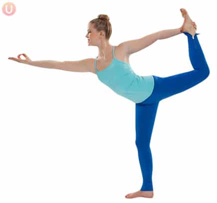 Chloe Freytag demonstraing Dancer Pose in a blue tan top and yoga pants