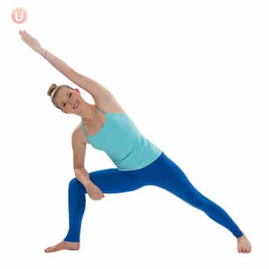 Chloe Freytag demonstrating Extended Side Angle Elbow on Knee in a blue tank top and yoga pants
