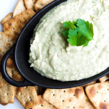 Dip into this creamy Italian white bean dip with fresh veggies or whole grain crackers for a simple snack that is super tasty and easy to make!