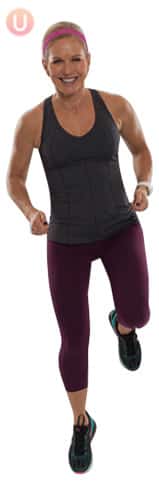 Chris Freytag demonstrating jogging in place wearing a workout top and pants.