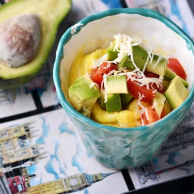Healthy omelette in a mug with tomatoes and avocado