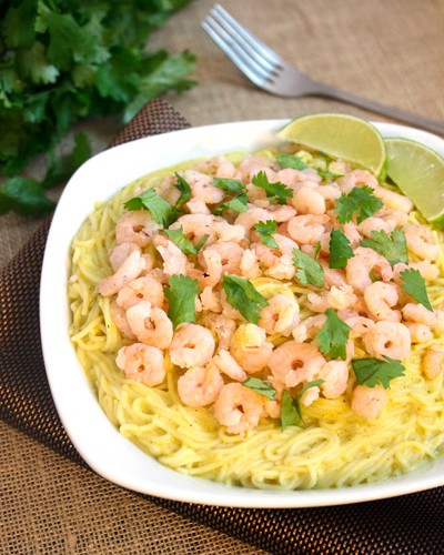 Shrimp Pasta with Creamy Curry Sauce on a white plate.