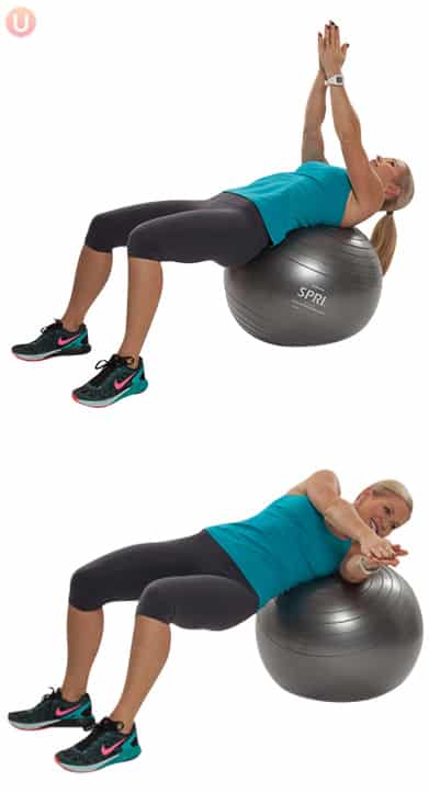 Chris Freytag demonstrating Stability Ball Core Rotation in a blue tank top on a silver stability ball