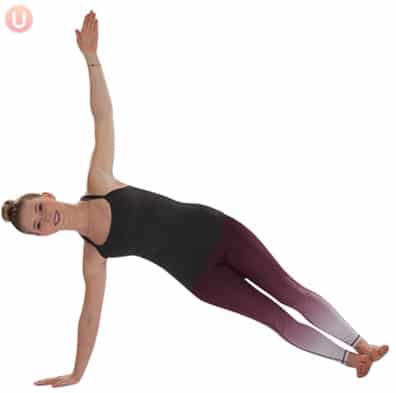 Chloe Freytag demonstrating Side Plank Pose in a black tank top and yoga pants