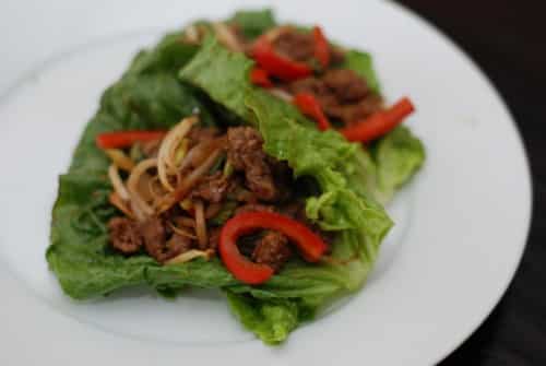 Mu Shu Beef Lettuce Wraps on a white plate.