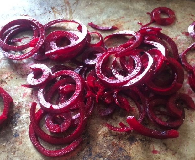 A pan filled with spiralized roasted beets