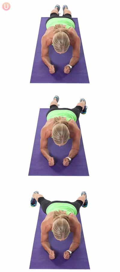 Chris Freytag demonstrating In In Out Out Plank in a green tank top on a purple yoga mat