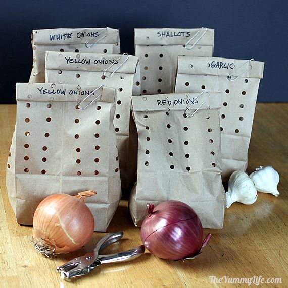 Bags of onions and garlics for a hack to keep them fresh and last longer.