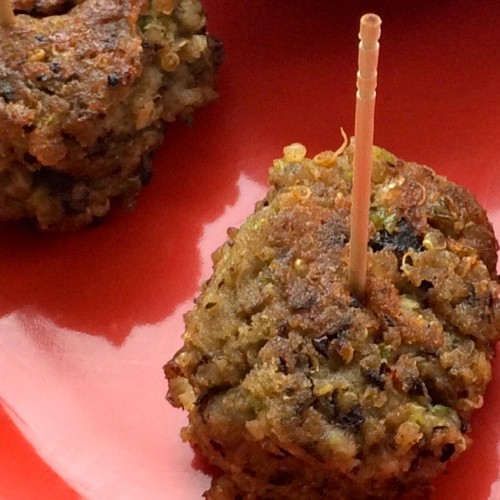 a close up of a crunchy and tasty black bean and quinoa ball.
