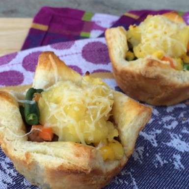 This handheld mini shepherd's pie recipe is perfect for a crowd! This healthy muffin tin recipe made with turkey and puffed pastry is easy, but tastes gourmet.