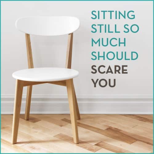 An office chair next to a white wall with the words "Sitting Still So Much Should Scare You" next to it.