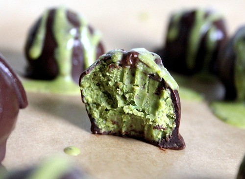 Vegan Dark Chocolate Emerald Truffles on a kitchen counter.