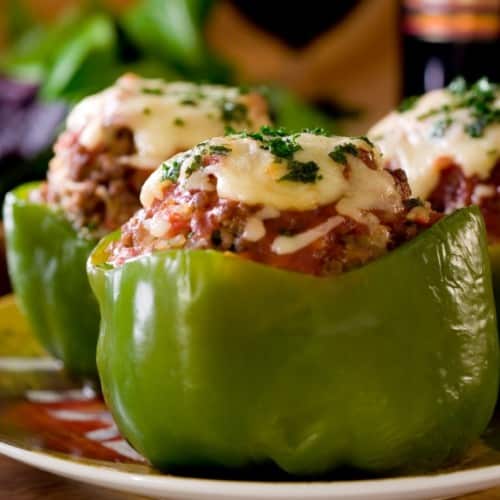 A green pepper stuffed with quinoa and ground turkey, with melted mozzarella on top.