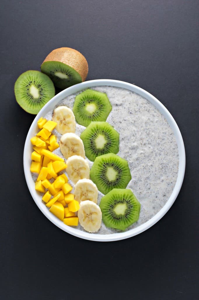 The chia seed breasfast smoothie bowl topped with kiwi, pineapple, and bananas.