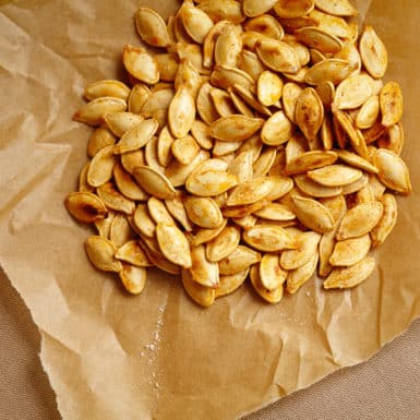 Change up your snacking with these healthy cajun roasted pumpkin seeds. Hint: they're super easy to make!