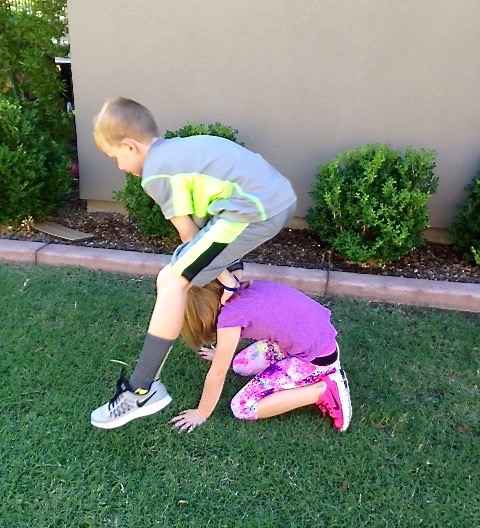 Show your kid exercising can be fun with a game of leapfrog.