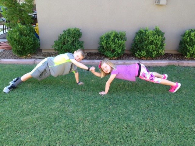Do patty cake push-ups with your kids to show them how fun working out can be!
