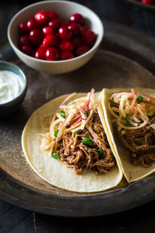These gluten-free dilatory  cooker chipotle pulled pork tacos with cranberries and apples are the cleanable   steadfast   wintertime  repast  packed with macromolecule  and sassy flavor!