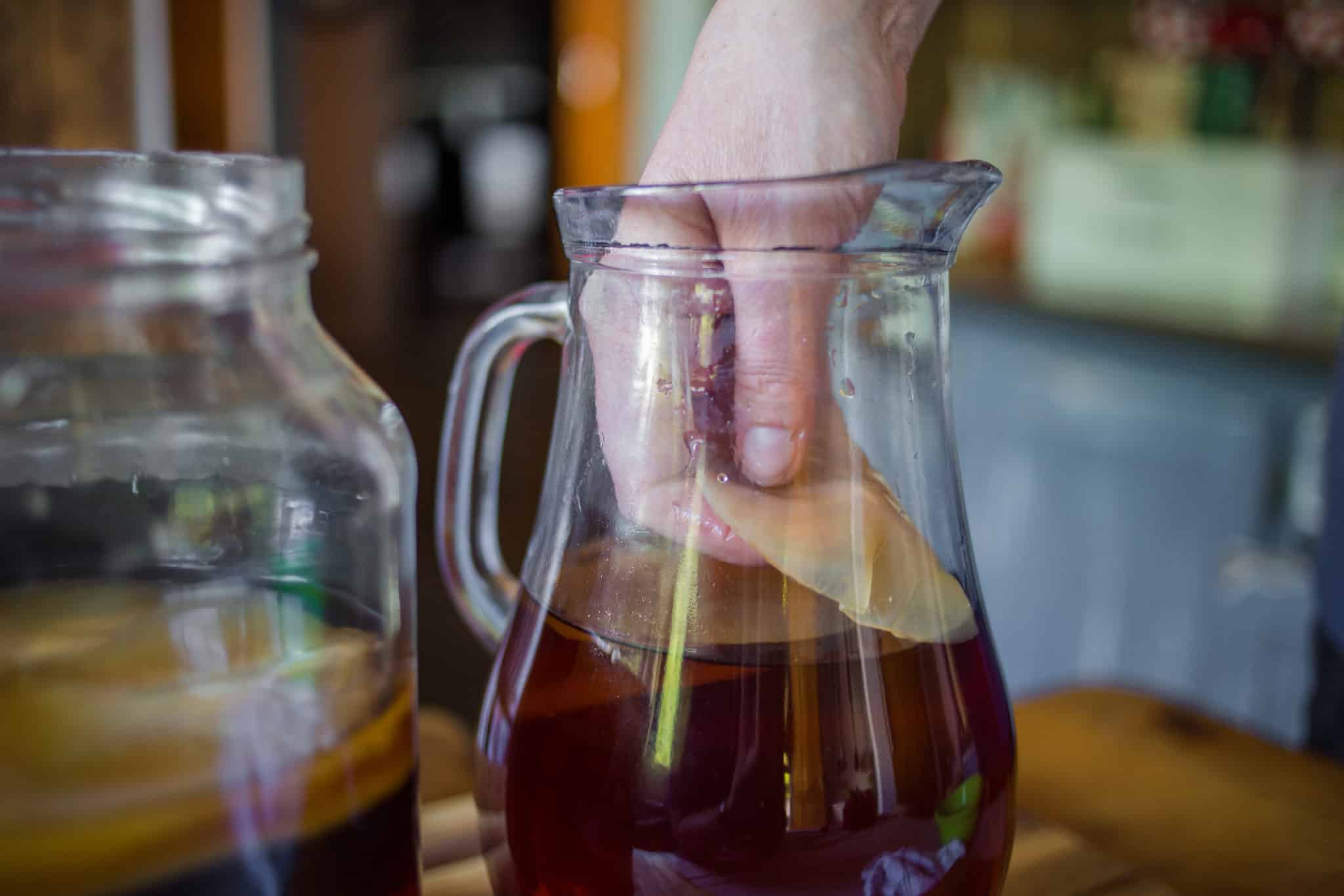 Kombucha in a glass pitcher with "mother"