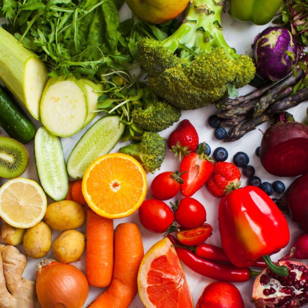 colorful display of raw anti-inflammatory foods in rainbow groupings