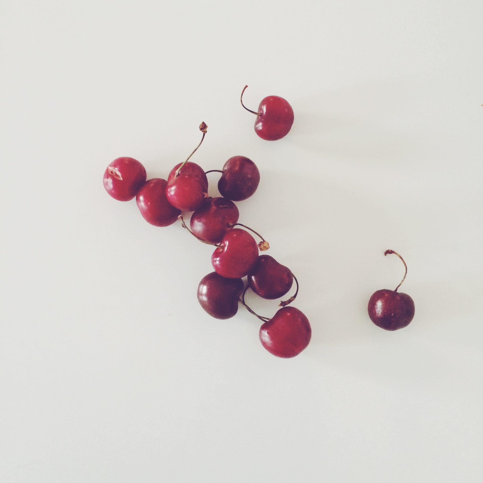 Cherries on white table