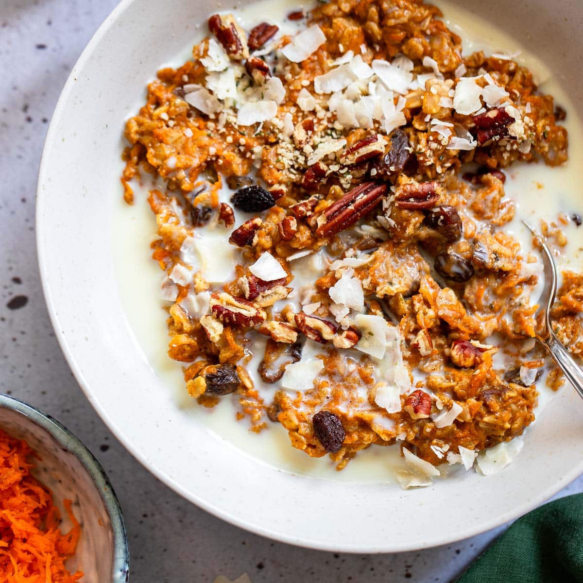 close up shot of carrot cake oatmeal in bowl