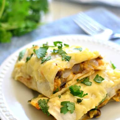 These tasty sweet potato black bean burritos with aged cheddar are delicious! A tasty low-fat make ahead meal that is family friendly and healthy.