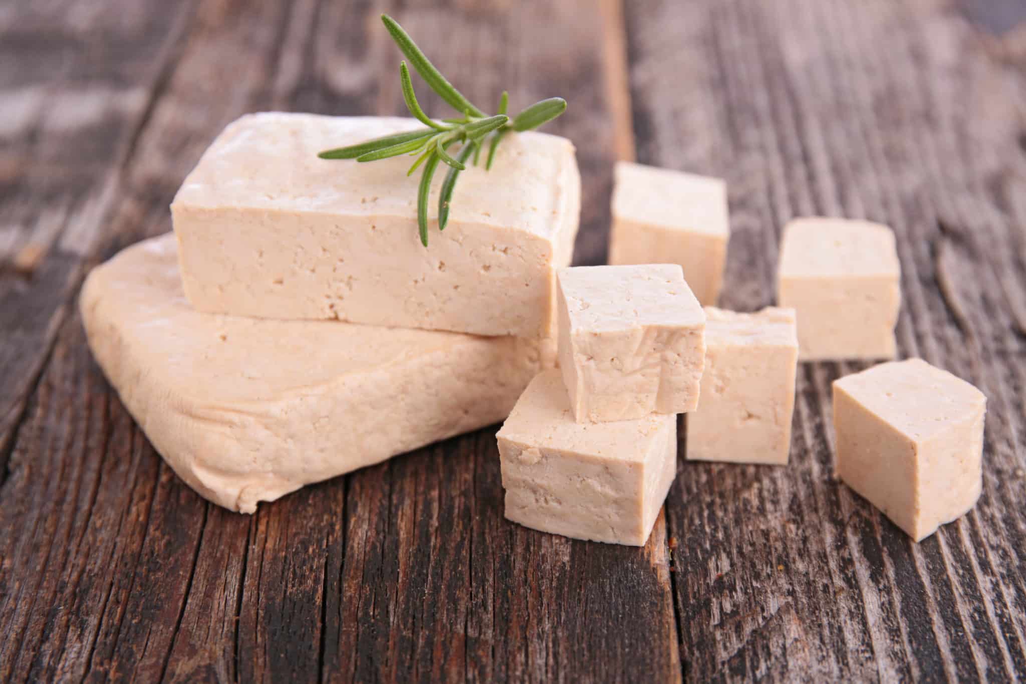 A block of tofu cut into pieces.