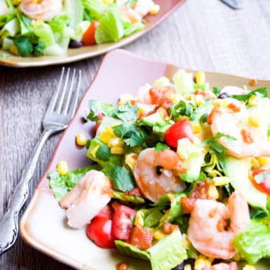 Spice up dinner with this easy grilled shrimp and corn salad recipe topped with low-fat creamy chipotle dressing.