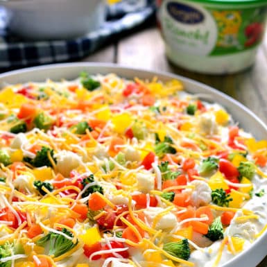 Whip up this healthy and colorful gluten-free veggie pizza dip in just minutes for a delicious appetizer!