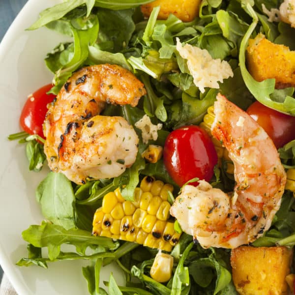 This perfect grilled salad screams summer with delicious produce and protein-packed shrimp.
